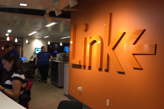 spotlight on the word Link in orange on the wall